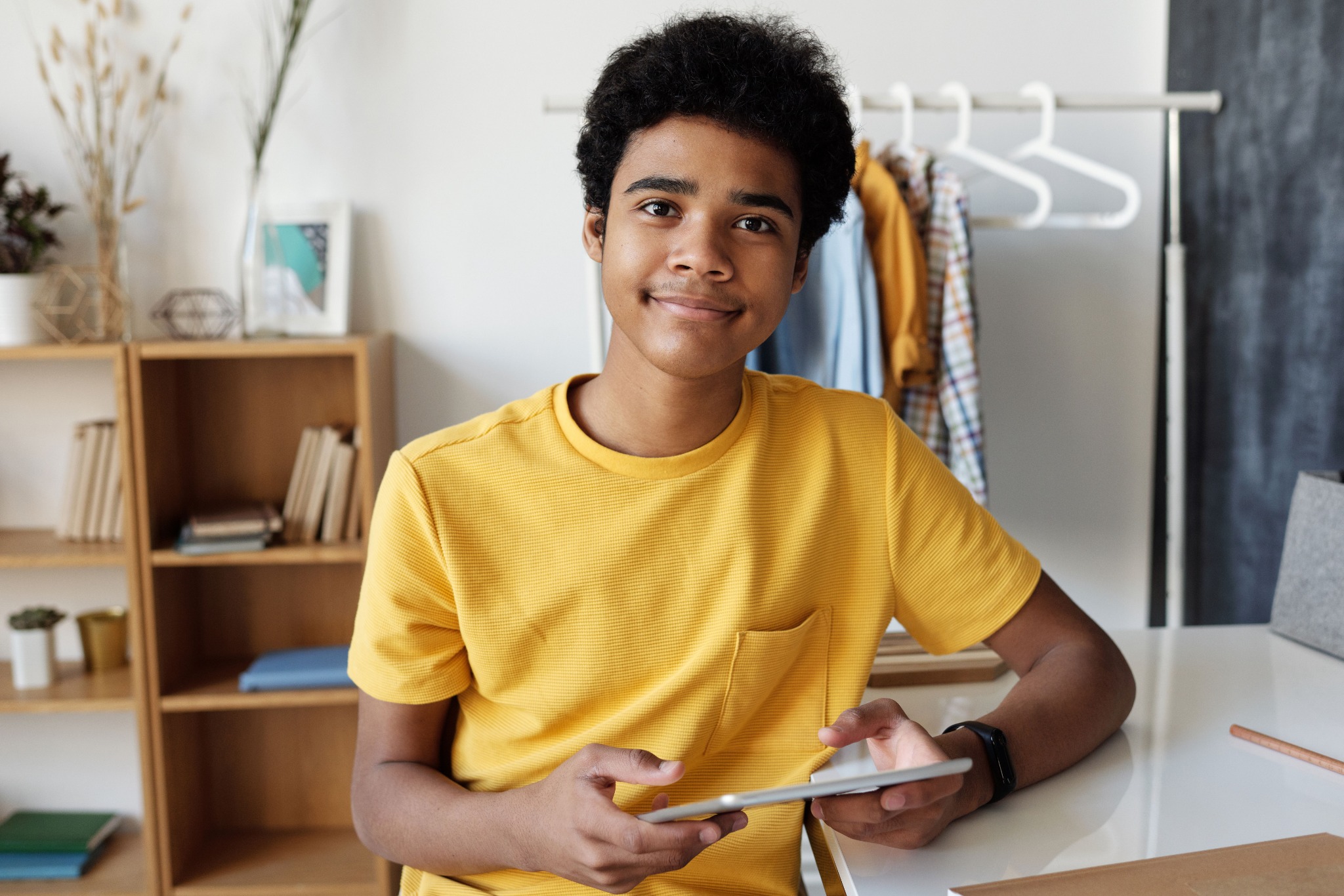 Student smiling while studying at home